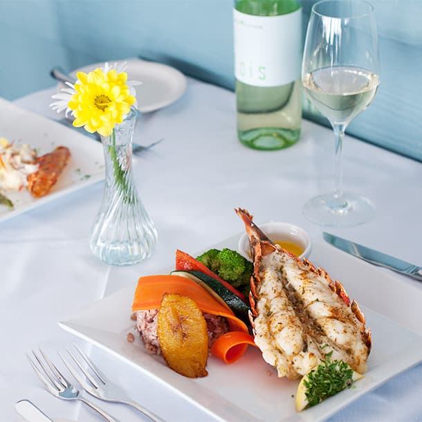 Restaurant table with food and wine